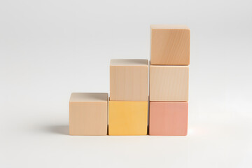 wooden building blocks stacked in a row, white background