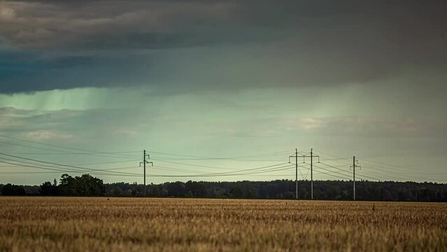 Rainstorm over a farmland field of wheat - storm chaser time lapse