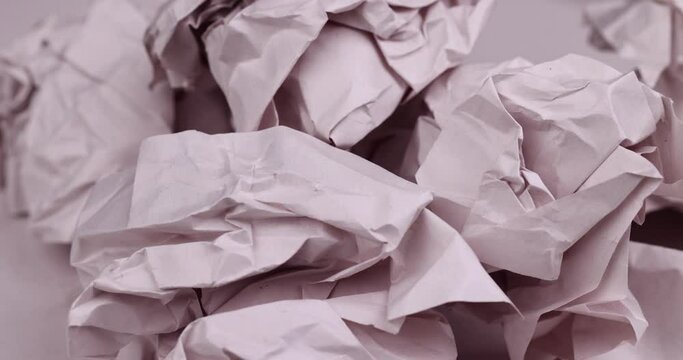 gray low-quality crumpled paper from recycled waste paper , crumpled recycled paper used for writing