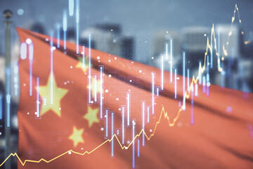 Abstract virtual financial graph hologram on flag of China and blurry cityscape background, forex...