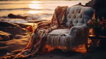 Obraz premium A chair sitting on a beach next to the ocean