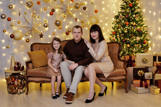 Happy family sitting in christmas decorated room