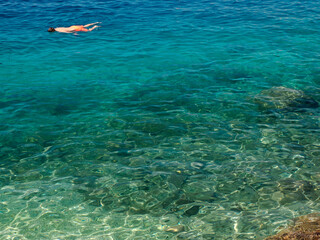 crystal clear water of Adriatic sea in Brela on Makarska Riviera, Dalmatia, Croatia