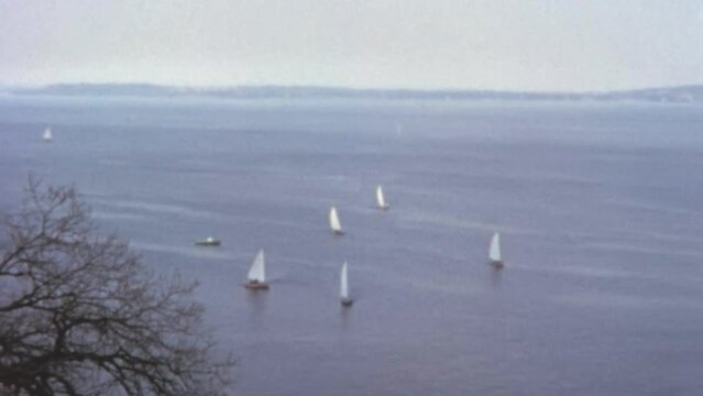 1960s Madison Lakes sail boat cruising on a sunny summer day. Vintage retro footage of Lake Mendota and Monona, Wisconsin.
