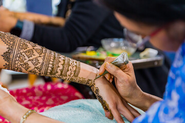 Indian Hindu bride's henna mehendi mehndi hands close up