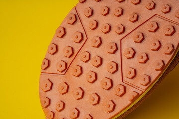 Rubber sole of a sports sneaker close up