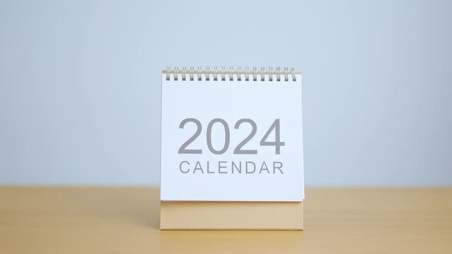 2024 Year Calendar on table background. Happy New Year, Resolution, Goals, Plan,  Action, Mission and financial Concept