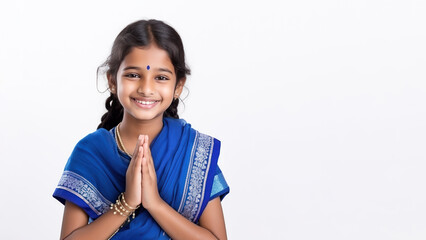 Indian girl in blue sari cloth praying, greeting diwali celebration