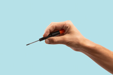 Black male hand holding a screwdriver for repair isolated on cyan background