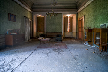 living room with sofas in an abandoned house