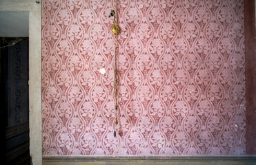 pink wallpaper in an abandoned house