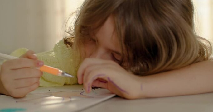 Colors of Innocence: Preschooler's Journey of Self-Discovery through Vibrant Pencil Strokes. High quality 4k footage