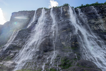 Geirangerfjord, Norway. The Seven Sisters waterfalls In Geirangerfjorden. Famous Norwegian Landmark And Popular Destination