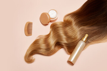 A piece of wavy blonde hair with healthy, glow over light background. Using hair mask and liquid conditioner. Concept of hair care, organic products, natural beauty, cosmetics. Ad. Poster.