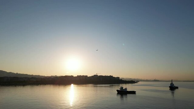 Drone video, sunrise marmara sea, floating boats, merchant ships in istanbul, view from above
