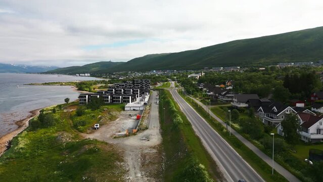 Tromso neigborhood next to fjord, aerial down Troms&oslash;ysundvegen E8