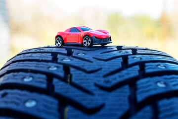 a model of a car with winter tires. the concept of road safety in winter