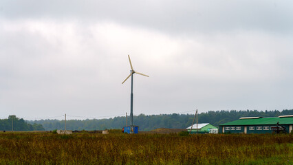 Landscape on rural farm with wind generator