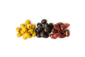 Set of green, red and black olives isolated on a white background. Various types of olives and fresh olive leaves. flat lei. Delicacy. Close-up.
