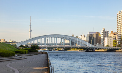 Tokyo cityscape with bridge, river and television tower