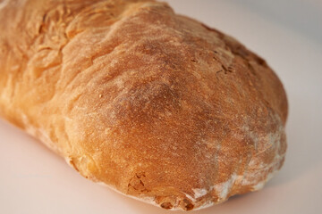 Homemade sourdough bread on white background. Sourdough bread isolated on white background, photo angled and from above.