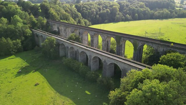 Chirk Aqueduct and railway Viaduct - aerial drone anti-clockwise flyover, revealing canal and railway below - Welsh, English border, Sept 23
