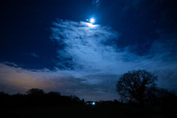 Moon in cloudy cliff