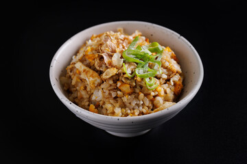 Japanese fried rice yakimeshi isolated in black background