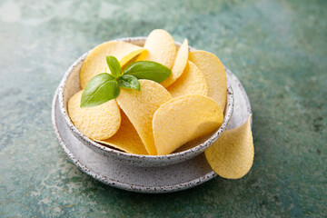 Traditional potato chips in a bowl