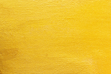 Gold concrete wall texture or background  and copy space.