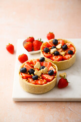 Homemade tarts with strawberry and blueberry