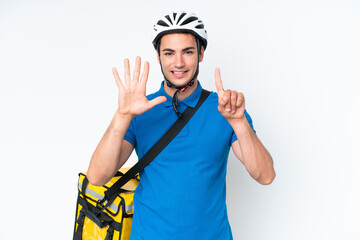 Young caucasian man with thermal backpack isolated on white background counting six with fingers