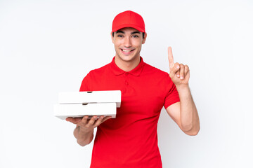 Pizza delivery caucasian man with work uniform picking up pizza boxes isolated on white background...