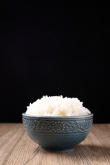 Thai rice isolated on wood background