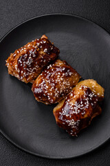 Delicious juicy fried chicken with sweet and sour teriyaki sauce and sesame seeds