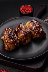 Delicious juicy fried chicken with sweet and sour teriyaki sauce and sesame seeds