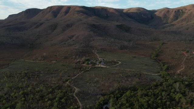 aerial view village in Chapada dos Veadeiros "Aldeia Macaco" hollow-shaped bioconstruction houses cerrado landscape Goi&aacute;s Brazil