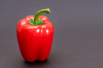 Fresh Red Sweet Bell Pepper on Black Background