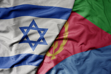 big waving national colorful flag of israel and national flag of eritrea .