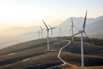 Natural technology of a wind farm with the clouds located in the mountains of Italy Europe and...