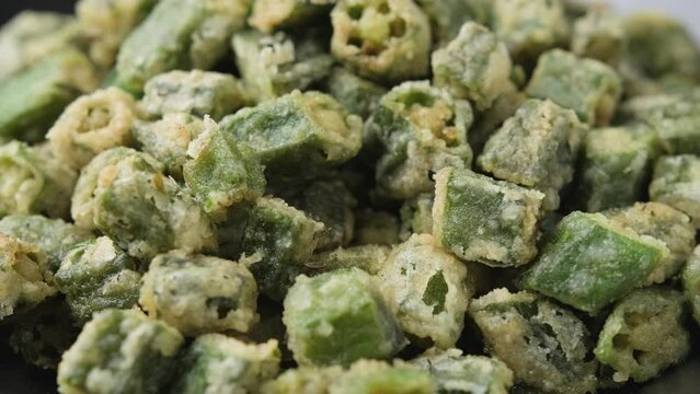 Eating Homemade deep Fried Okra with herbs and spices.