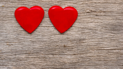 red hearts on wooden background