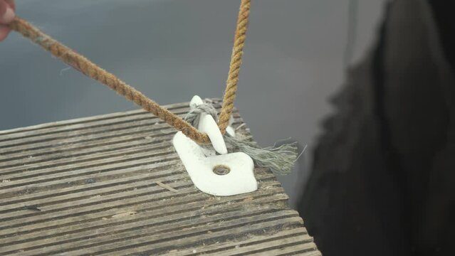 Tying the bowline on the dock cleat