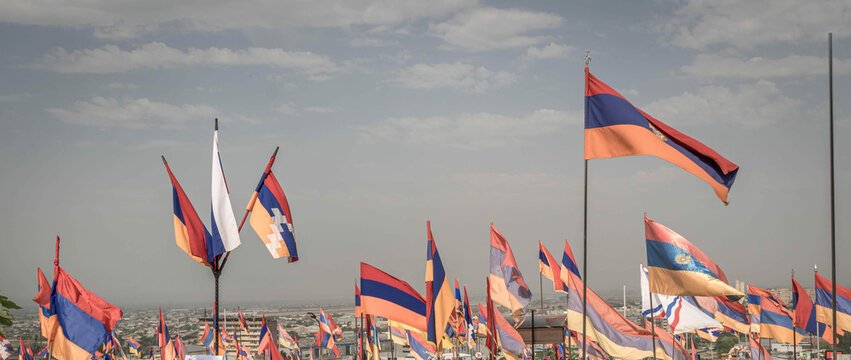 The flags of Armenia and the non-recognized Nagorno-Karabakh Republic (Artsakh) at the cemetery in Erevan, Armenia.