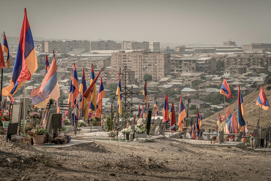 The flags of Armenia and the non-recognized Nagorno-Karabakh Republic (Artsakh) at cemetery in Erevan, Armenia.