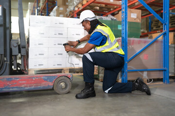 Distribution warehouse worker scanning bar code examining inventory in stock. Merchandise supervisor, logistic engineer working at storage room in storehouse for goods order and delivering management
