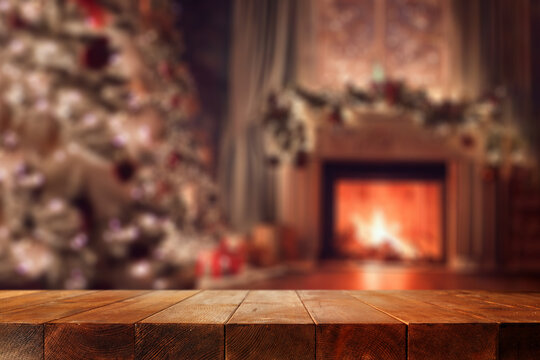 Desk of free space and winter home interior with fireplace 