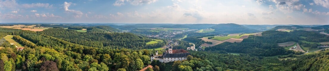 Fototapeta na wymiar Panorama aerial view of Greifenstein Castle near Heiligenstadt/Germany in the middle of forest in Franconian Switzerland