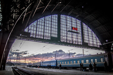Old train station in Lviv, Ukraine, Ukrainian train, evening, dark, clouds in sky, awaiting for departure,