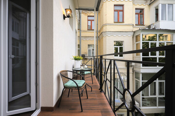 Outdoor terrace with table and chairs in the apartment